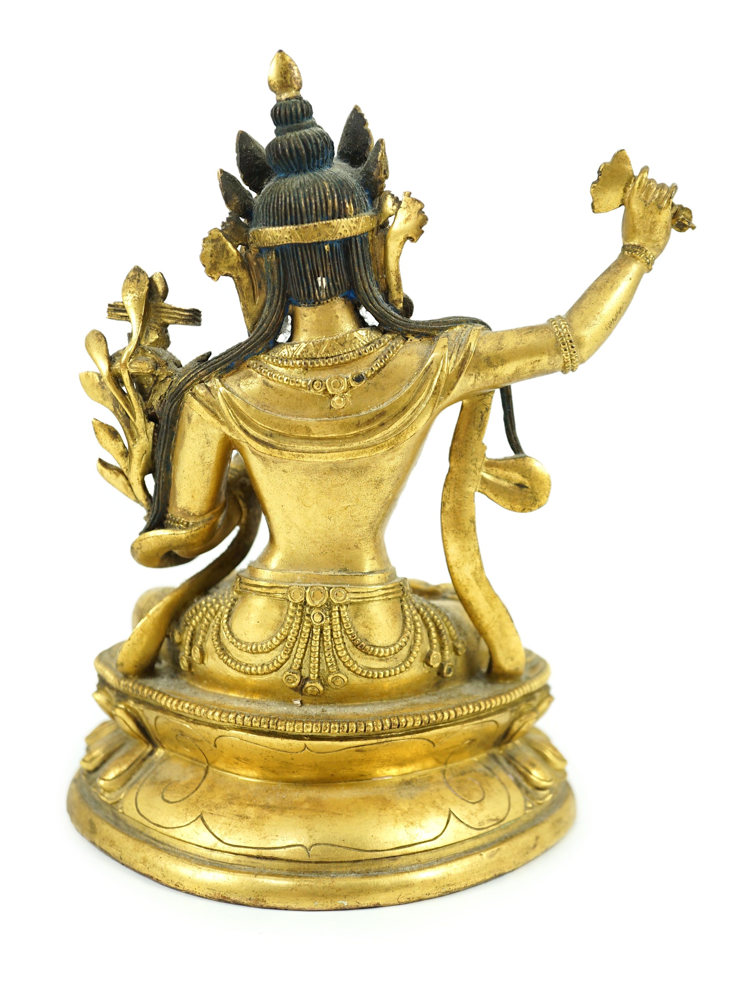 A Tibetan gilt bronze seated figure of Vajrasattva, 16.5 cm high